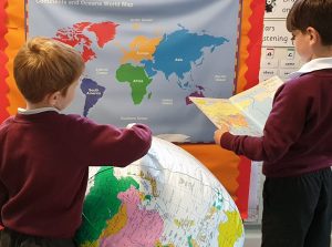 Map and globe in geography class