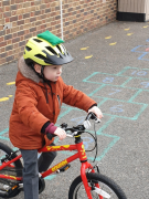Early Years pupil learning to cycle